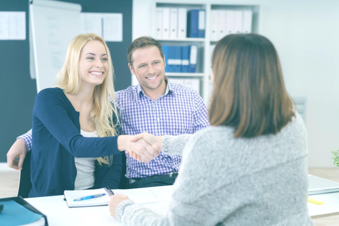 Students collaborating on financial analysis projects in modern learning space